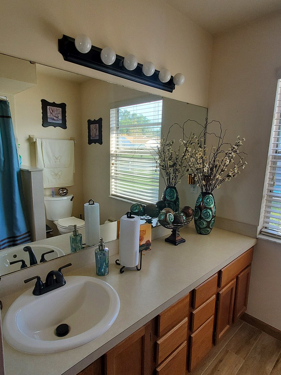 Nice sized bathroom with plenty of space to include a closet with shelving, drawers and under the sink cabinents in the bathroom. 