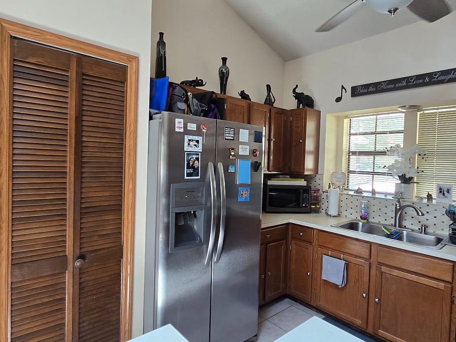Kitchen is fully stocked with dishes, utensils, cookware, lunch bags, etc. Modern Frigidaire appliances