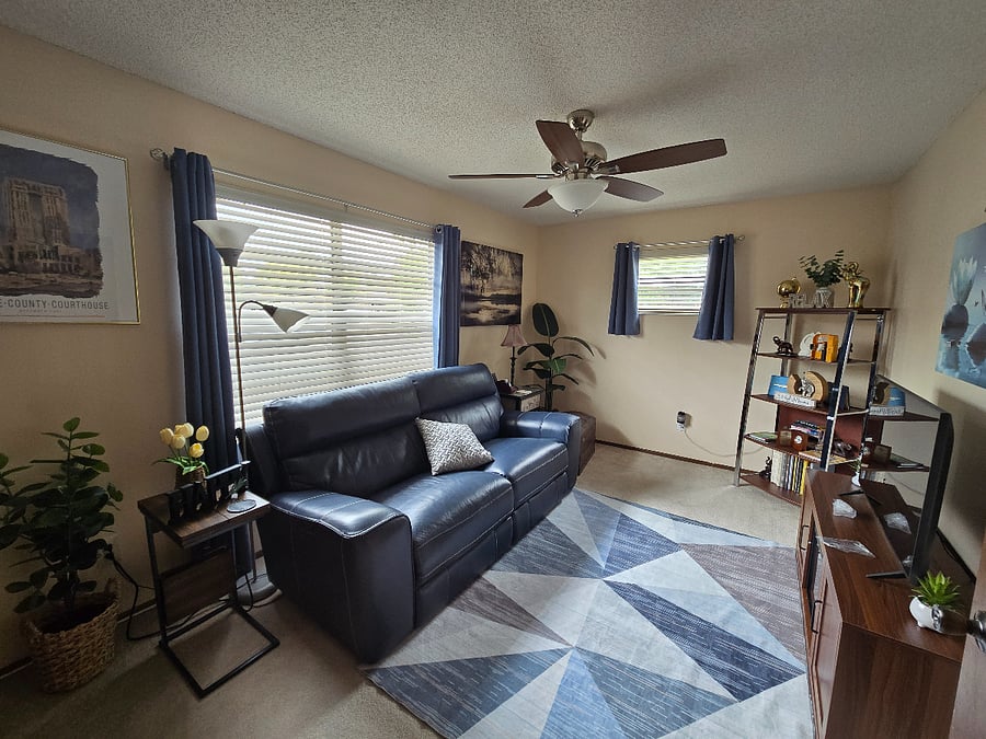 Relaxation lounge has modern love seat/couch that reclines electronically and has USB ports on both sides. 