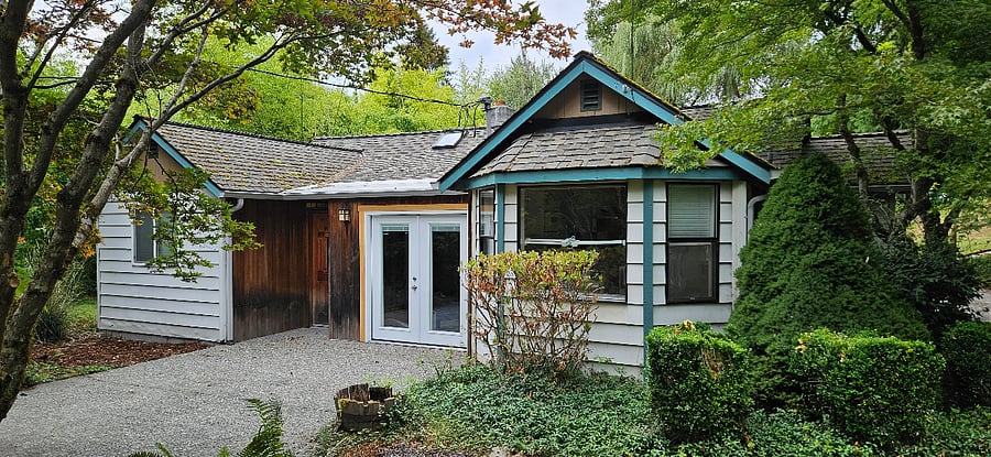 Front of house with patio and french doors with private front yard. Fenced private backyard with deck and raised bed garden. The Redmond Watershed with miles of forested hiking trails are 5 minute walk.