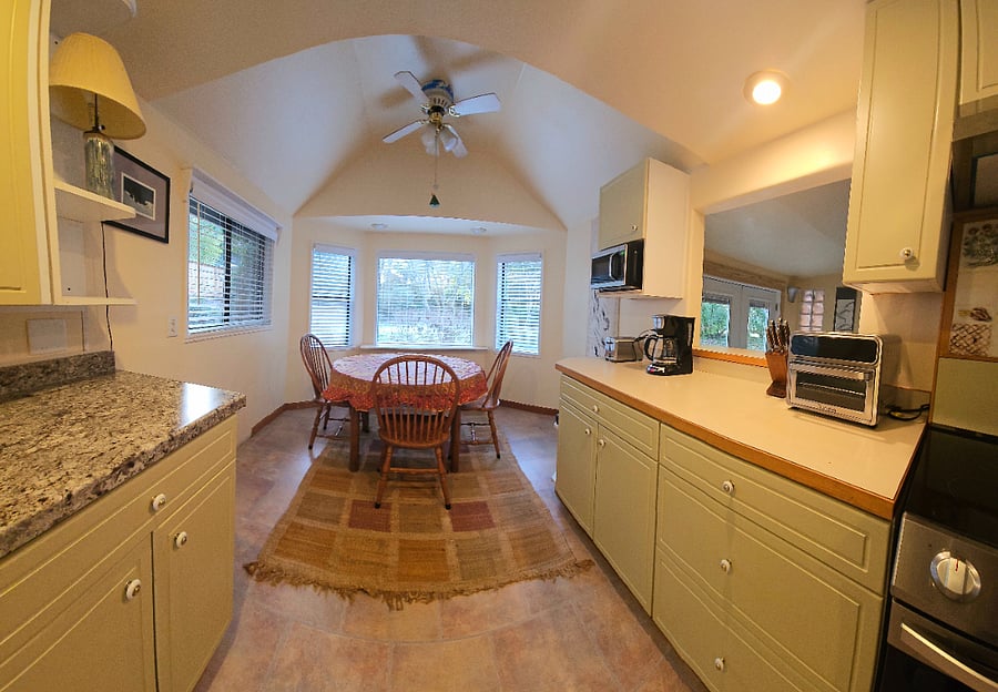 Cozy Breakfast nook next to galley kitchen.