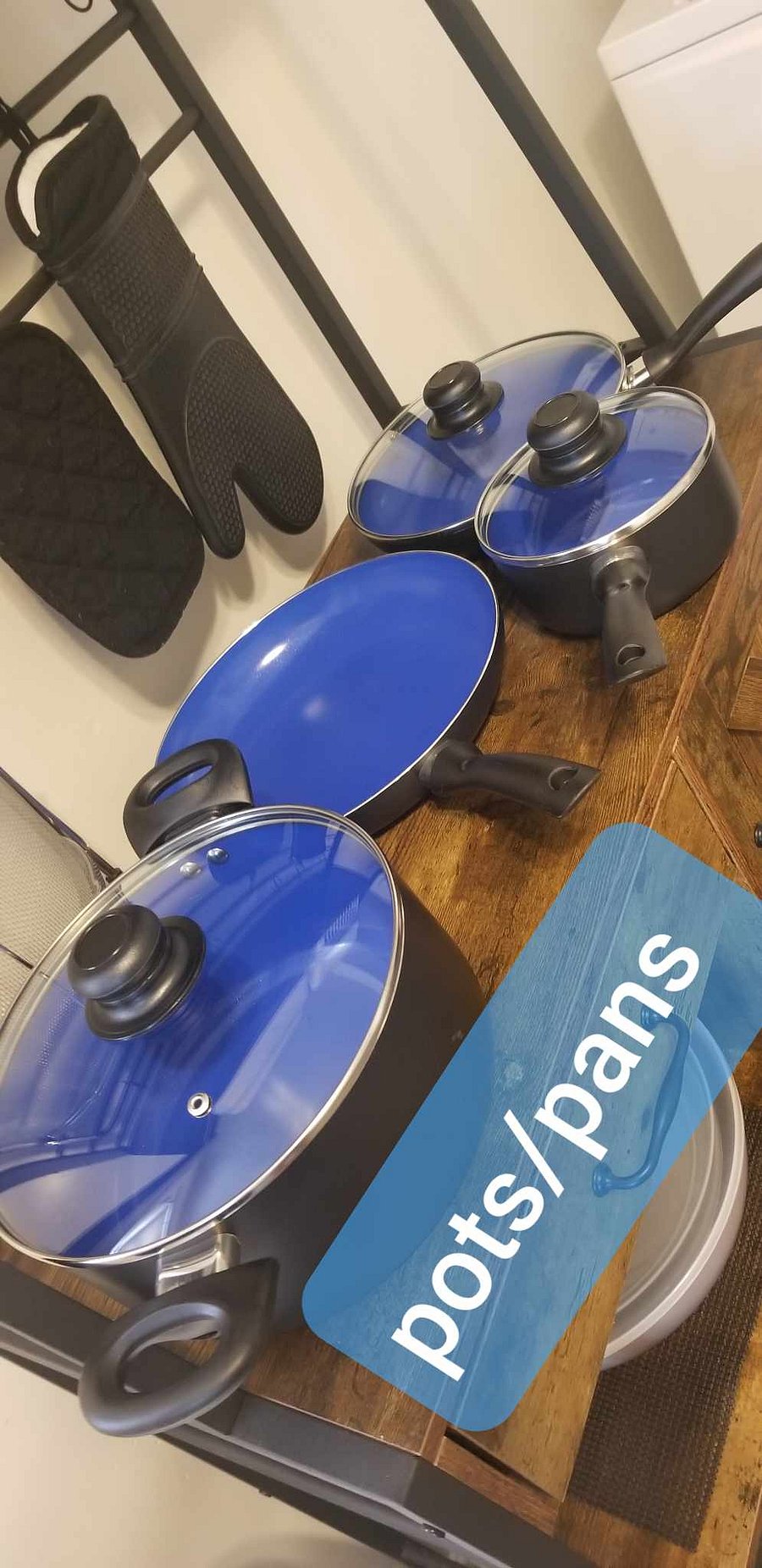 Pots Pans under sink on left side, stored below, displayed out for pictures