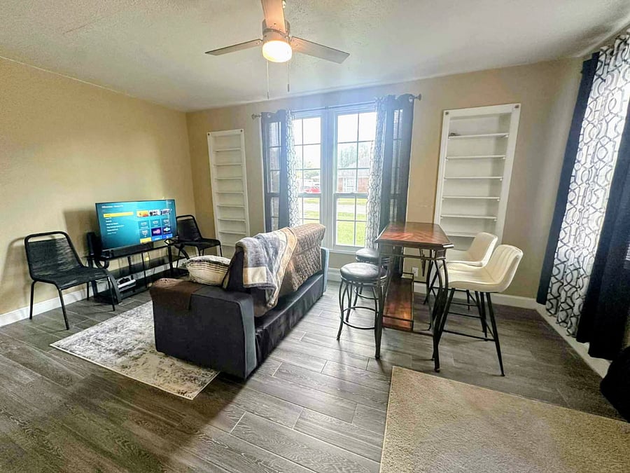 Walk in front door, dining to the right, living room couch TV