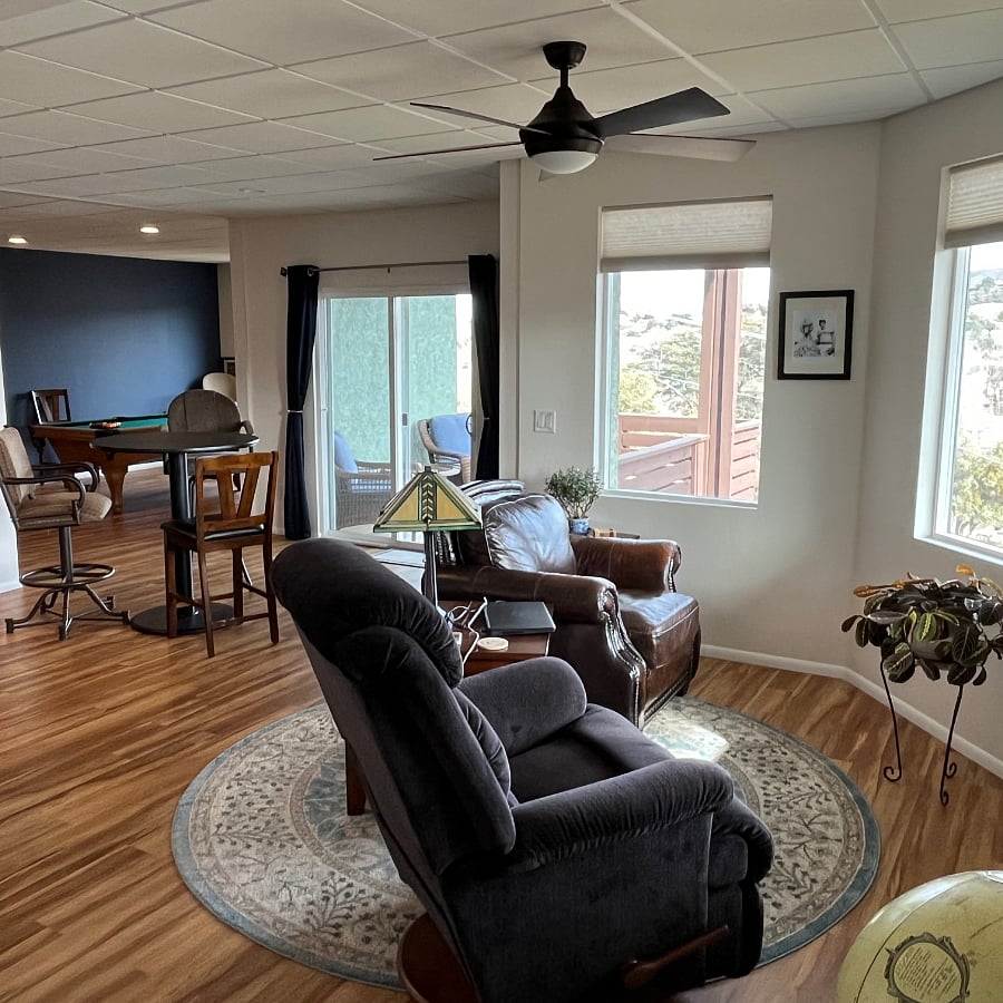 Reading area with sliding-glass door and picture windows