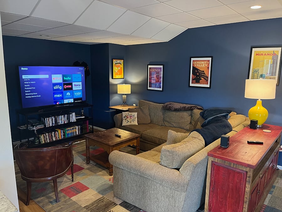 Viewing space with 65" Samsung TV and Crate & Barrel sofa