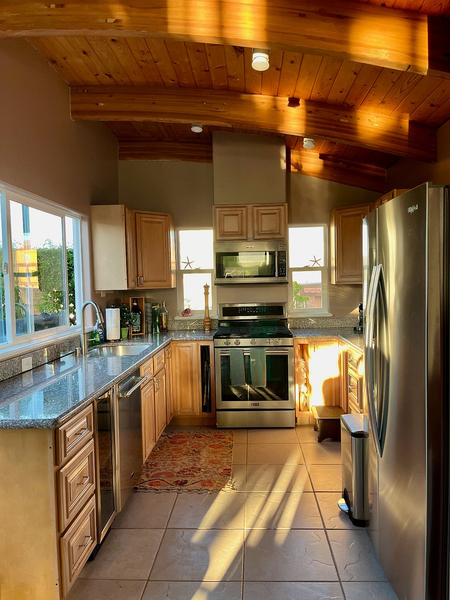 Full kitchen, sliding glass doors lead to meditation garden