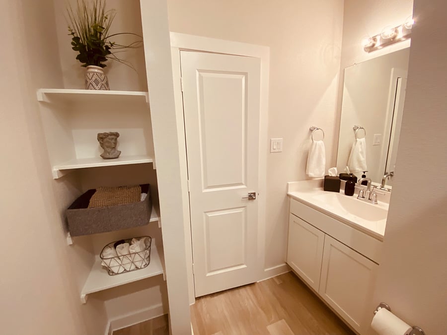 Store all of your essentials in the guest bathroom with ample shelving and storage to fit your needs.