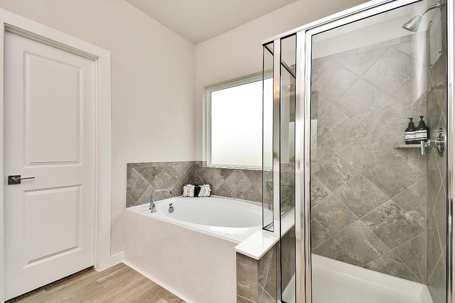 Escape it all with the serenity of the primary bathroom.