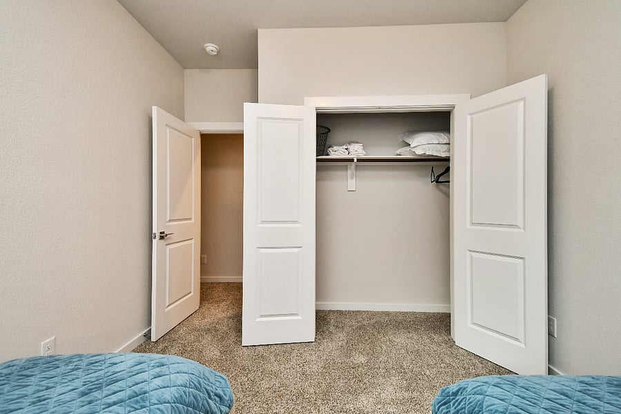 Store your clothing and personal items in the large twin closet with French doors.