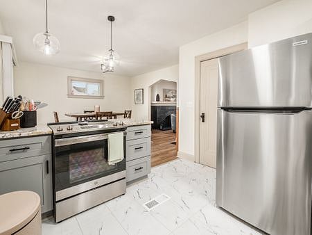 Brand new knife set, cooking tools, pots and pans and additional items located in the drawers next to the stove on both sides