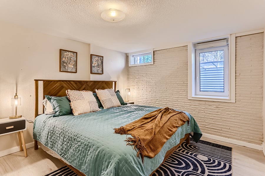 King bedroom - basement. Room has bonus area attached with room for second sleeping accommodations, second office, etc.