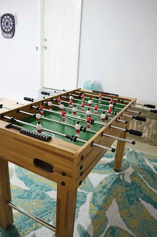 Foosball table & dart board in garage