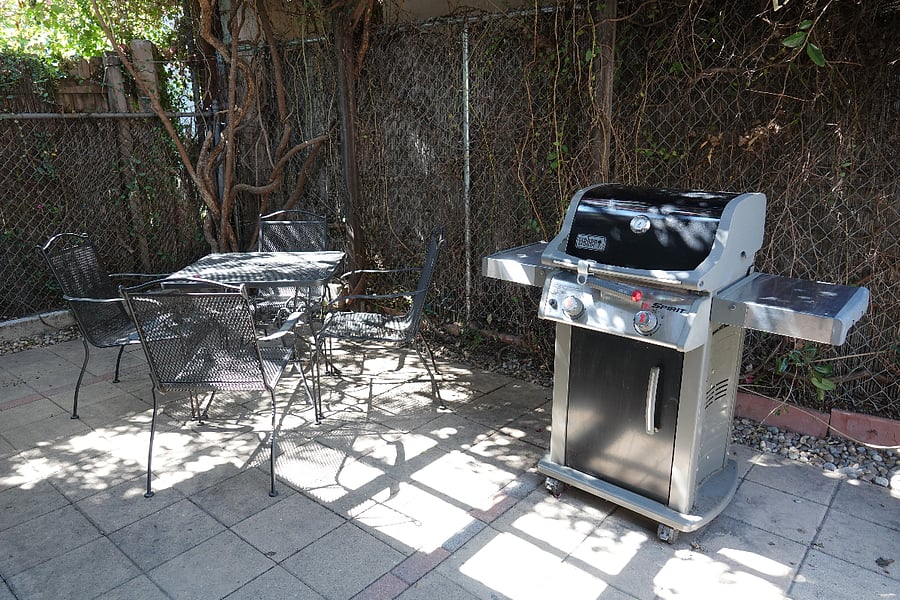 Seating for four at the outdoor table.  Weber propane grill.  1st tank included.