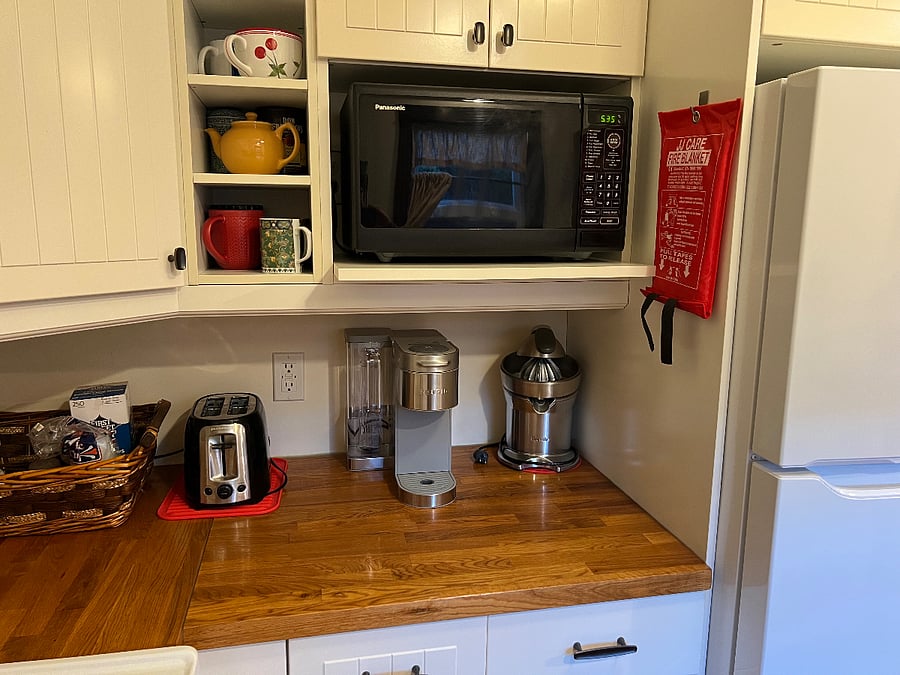 Microwave, juicer, Keurig coffee machine, toaster, slow cooker, Kitchen Aid mixer.