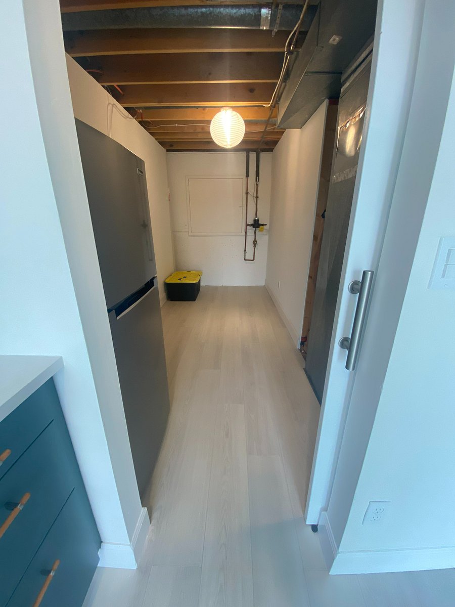 Barn door to pantry/storage room for easy access or closing off the clutter