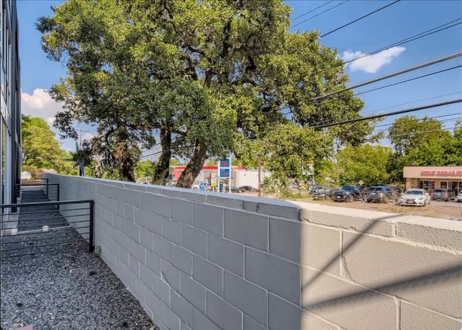 Sliding door access to your private back patio with a beautiful oak tree right out front.