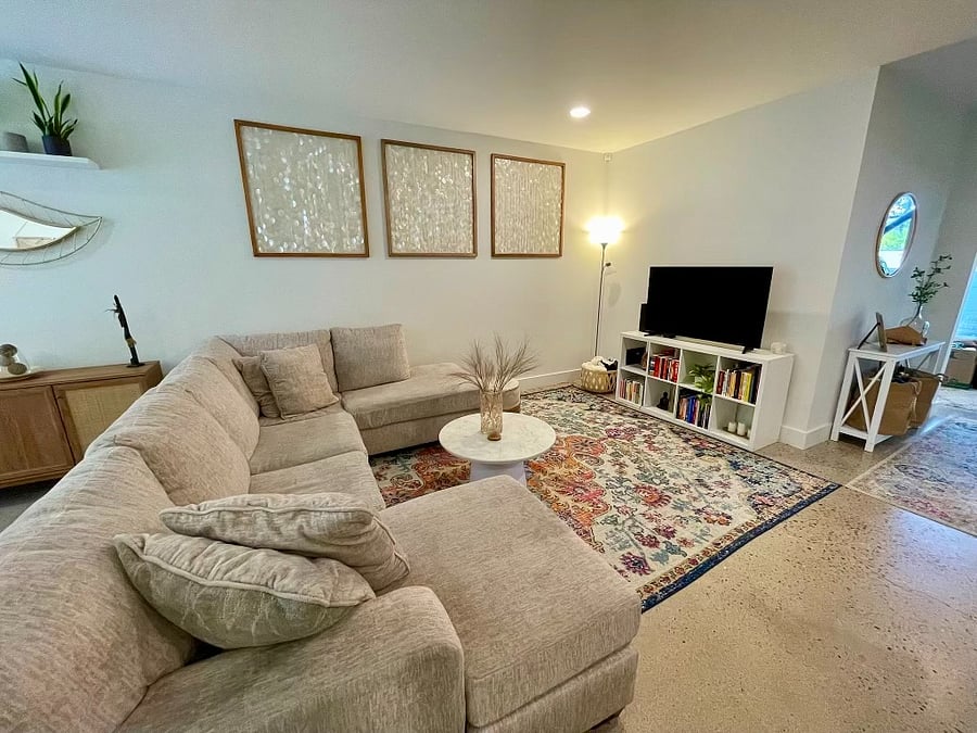 Large living room space with the most comfy large sectional couch (could also sleep an extra person) and flat screen smart TV.