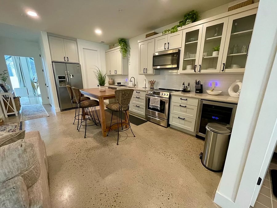 Newly renovated kitchen that comes fully equipped with all cooking essentials and stainless steel appliances. Includes a wine cooler and walk in pantry.