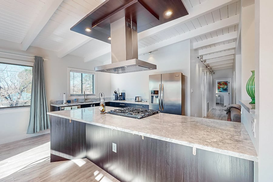 spacious kitchen with lots of counter space and plenty of storage. High-end range/oven, refrigerator, dishwasher, microwave.