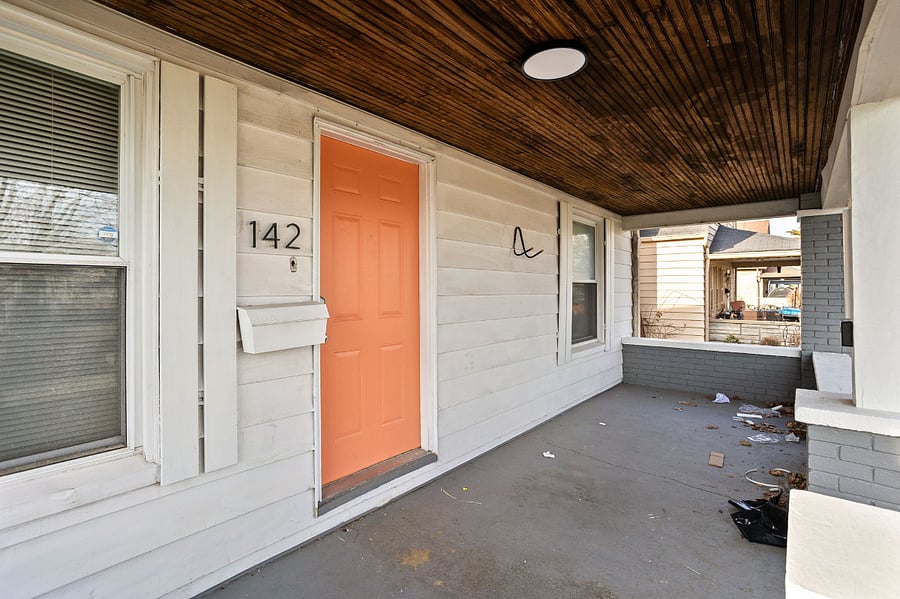 A charming front porch with character, ready for a little refresh!