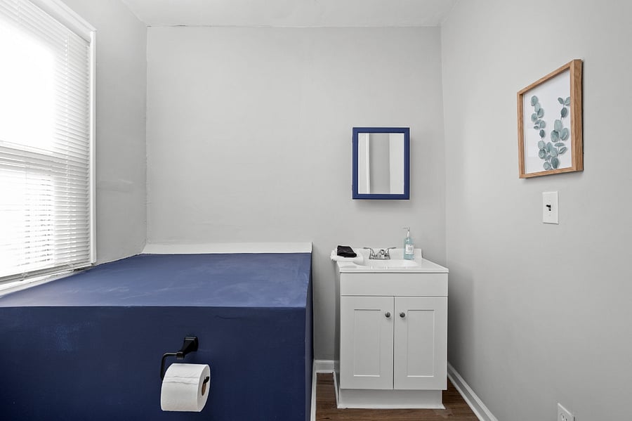 This space features a sink and cabinet, offering the perfect convenience for storing essentials and easy access.