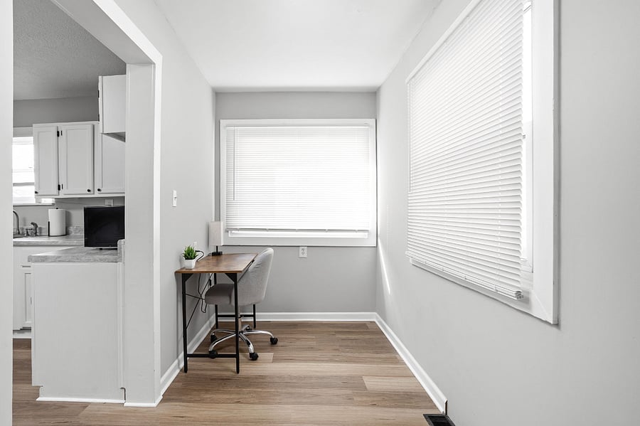 Minimalist home office nook with natural light and a modern touch.
