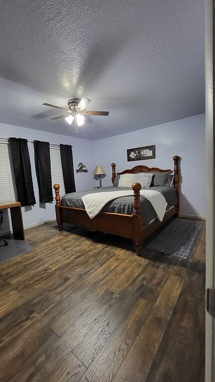 King bed in large master, nightstand, lamp and charging station
