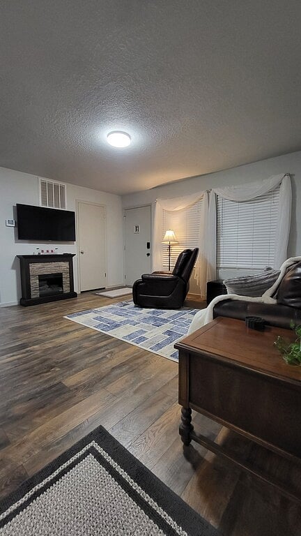 Living room with love seat and recliner, fireplace and TV with streaming options - Second recliner available if wanted