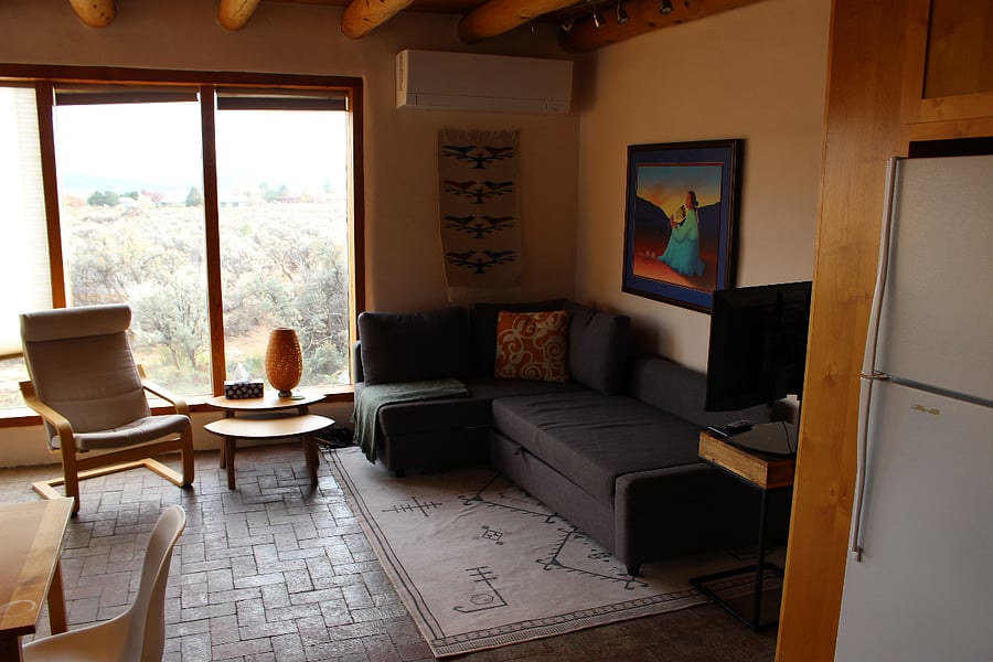 Television and couch that pulls out to accommodate guests