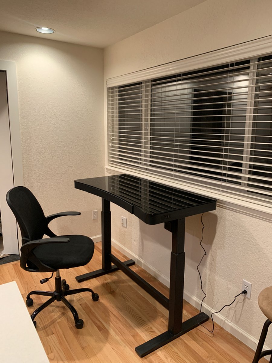 Adjustable stand up desk with views of the open space