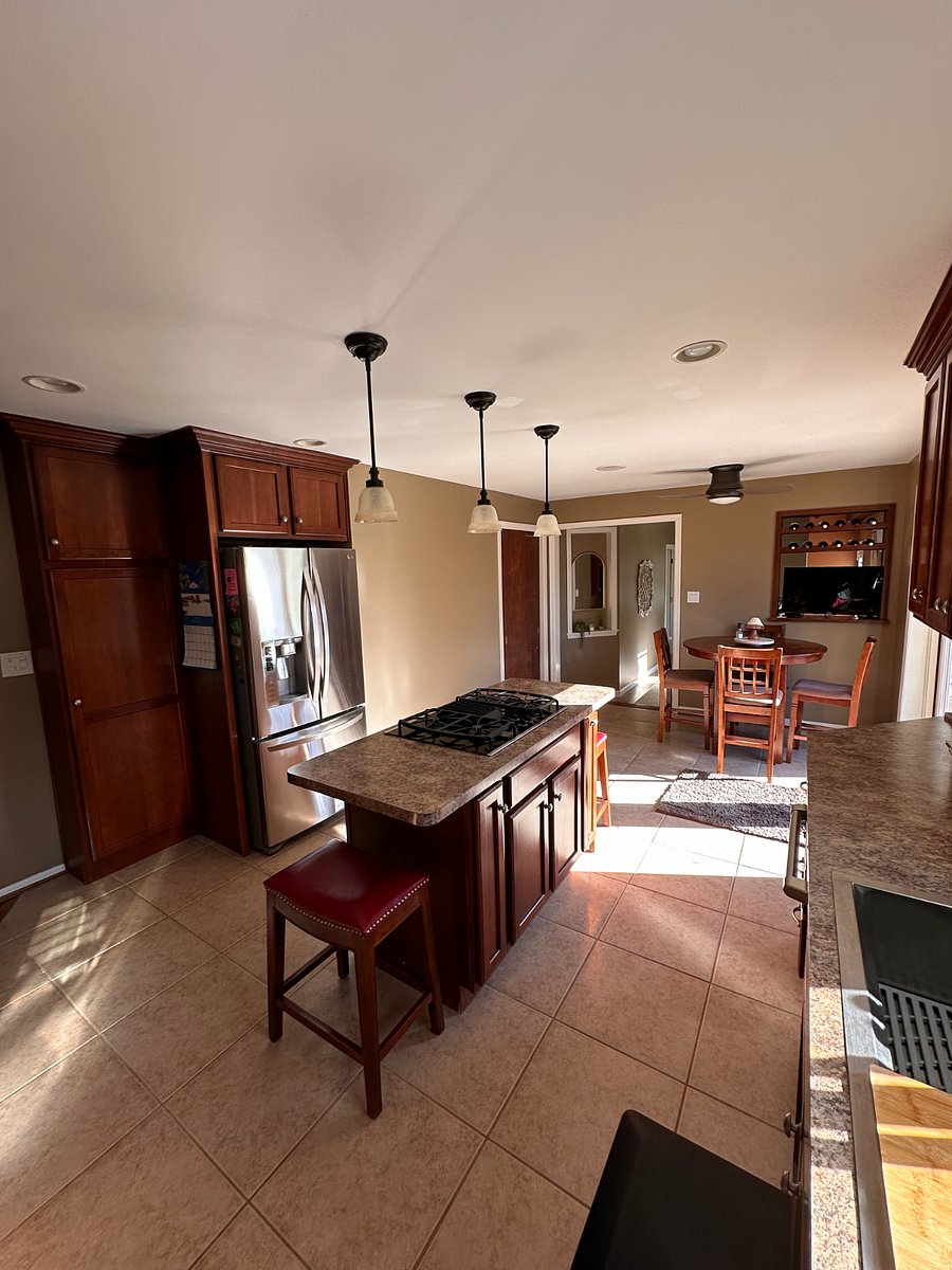 Back side of kitchen, looking towards back hall.