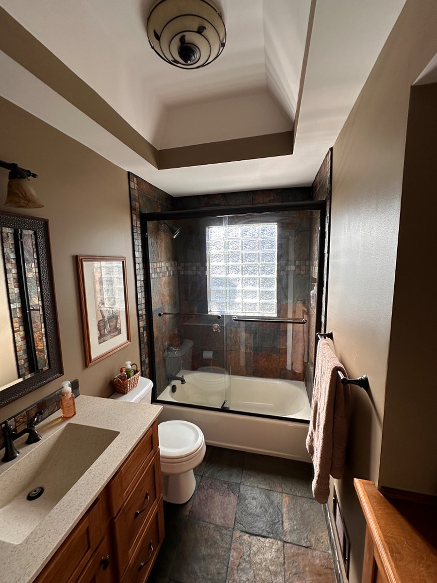 Hall bathroom looking towards obscure glass block on rear of house.