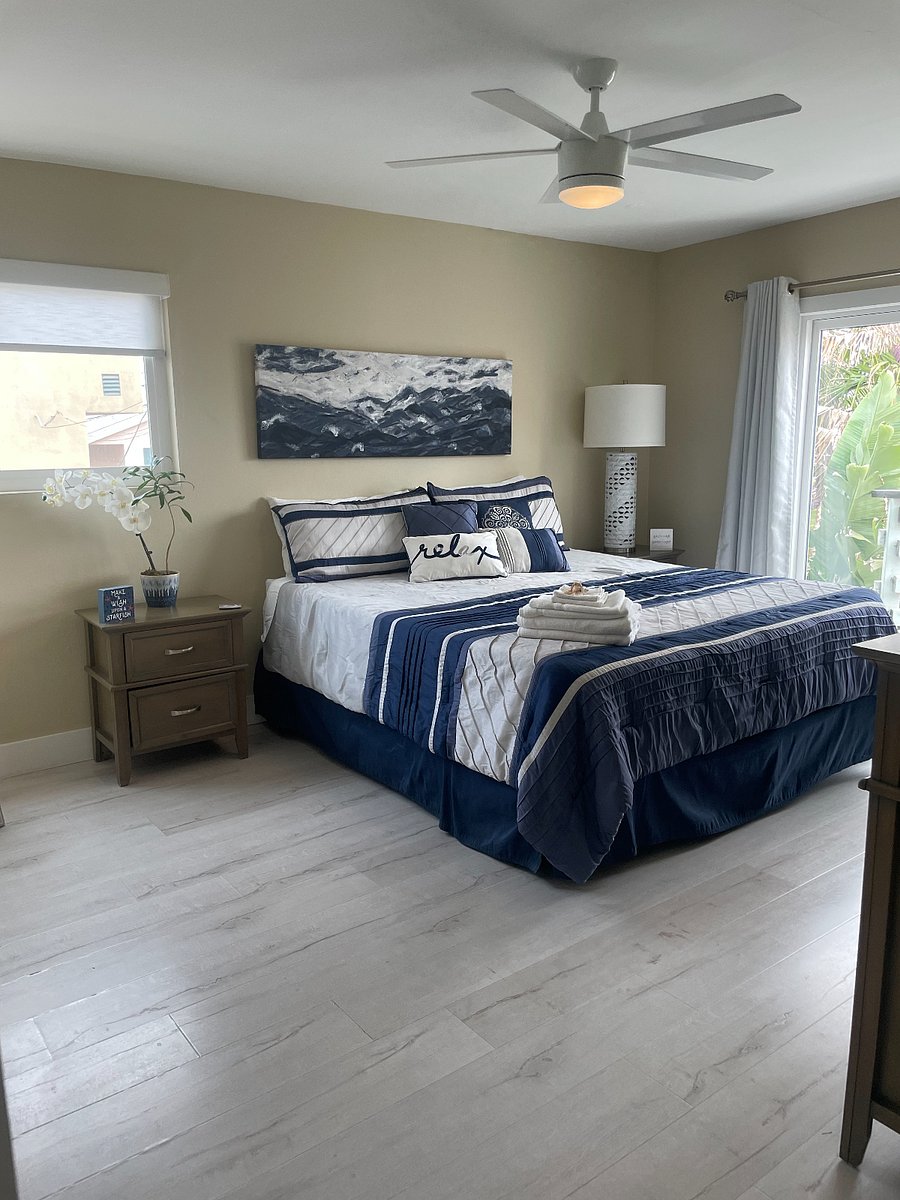 Large Primary bedroom on main level - King bed with plush 3" mattress topper, crisp linens, dresser, TV, night stands, large walk-in closet, en suite bath, full length glass slider door