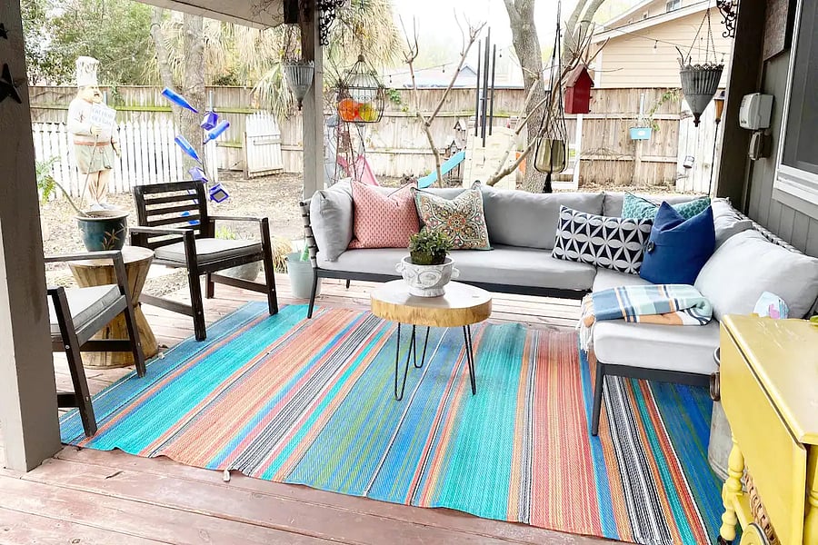 Covered Back porch with seating.