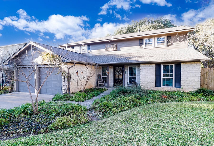 Large two story home with front yard, annual wildflowers, deer love to roam the yard.