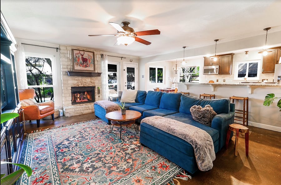 Downstairs - open living room, dining, and kitchen. Luxury custom, cozy, and kid friendly couch.