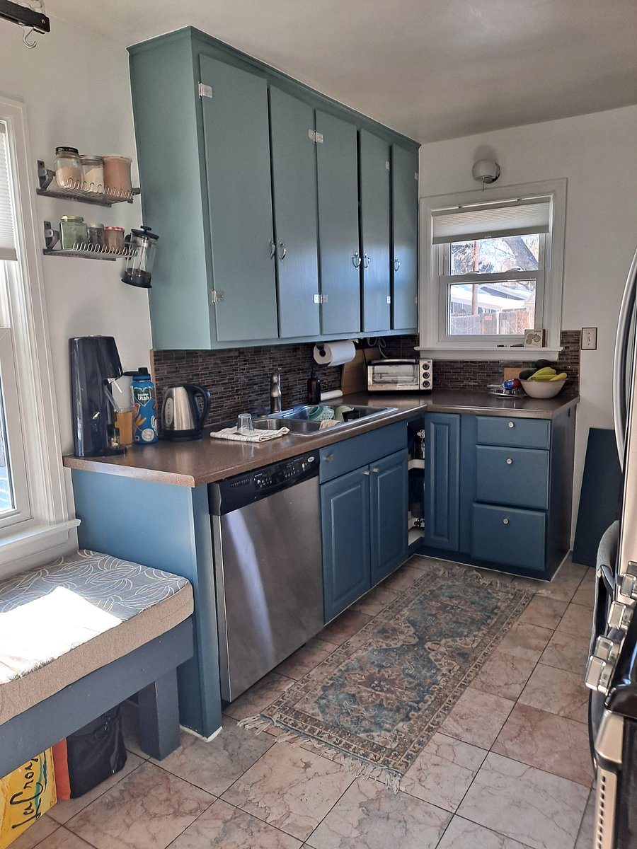 Standard appliances, plenty of fridge and storage space, gas range, cushioned window seat, kept tidy-ish.
