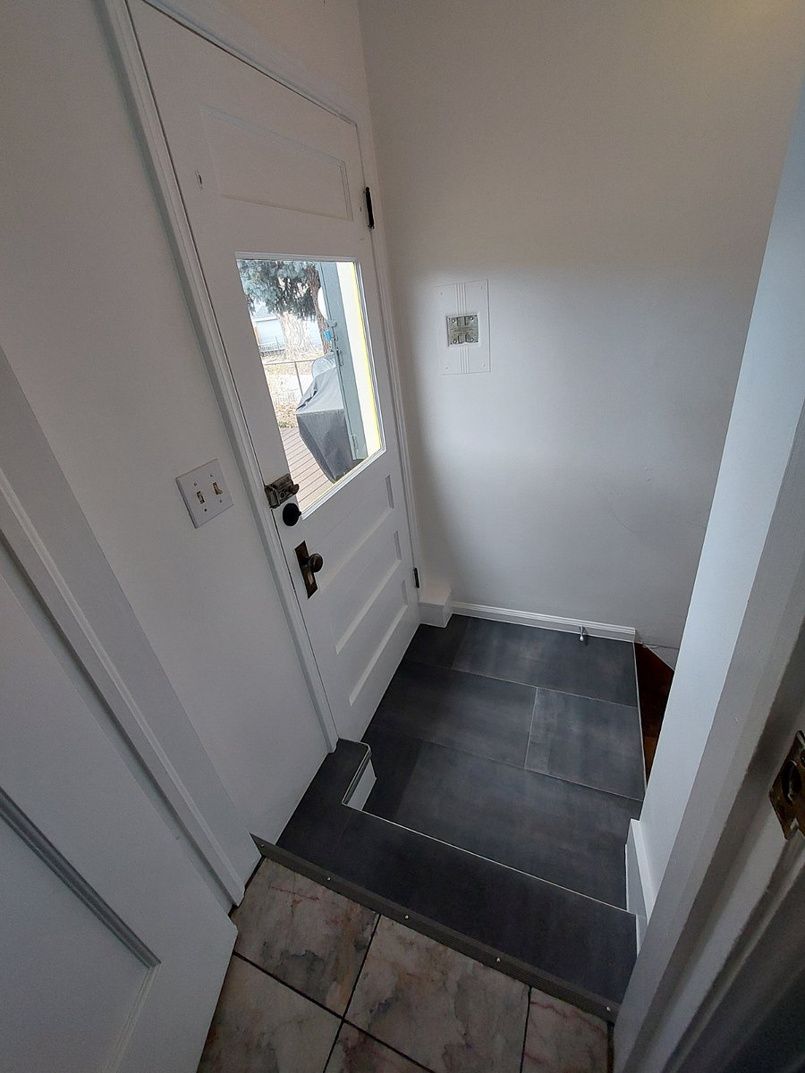 Your private entrance, as seen from the kitchen. Stairs to basement are to the right.