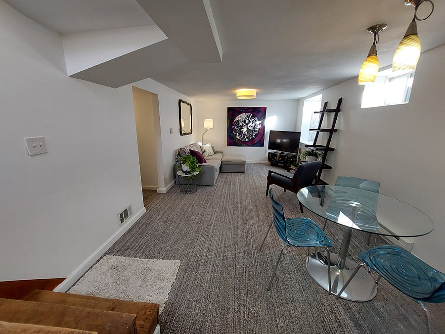 Hallway on the left leads to bedroom to the right, and pass-through closet and bathroom to the left