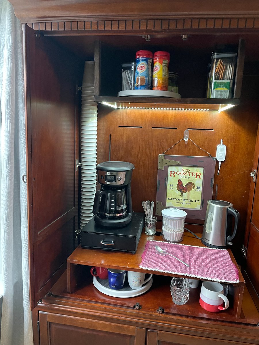 There is a coffee and tea station with lots of flavors of teas and creamers.