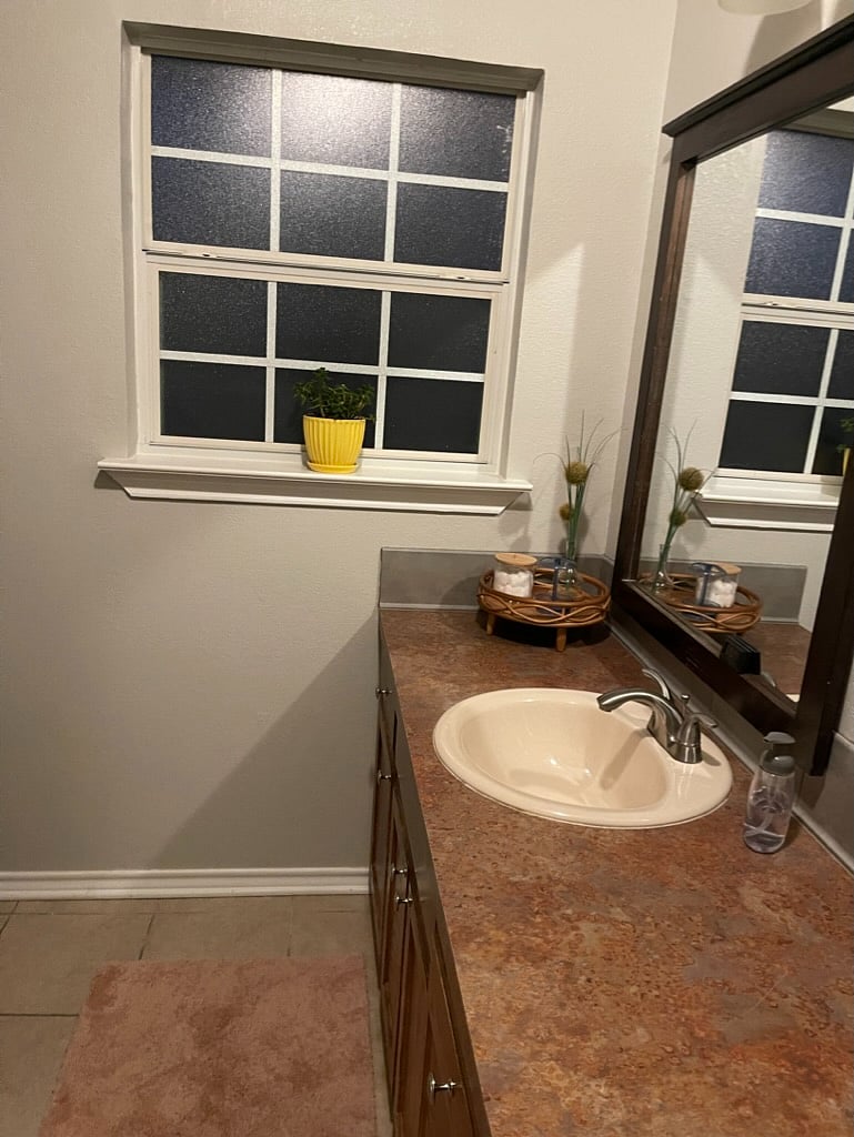 2nd full bathroom with tub, shampoo, conditioner and body soap.