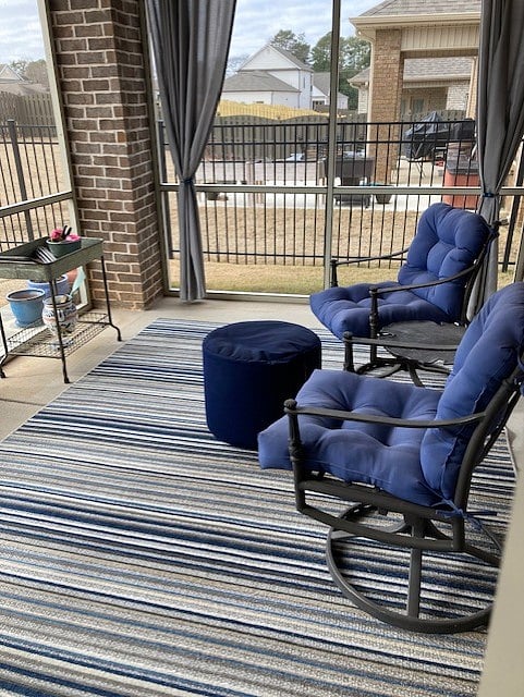 Screened patio; looks out on to backyard and empty lot that won't be built on for other community.