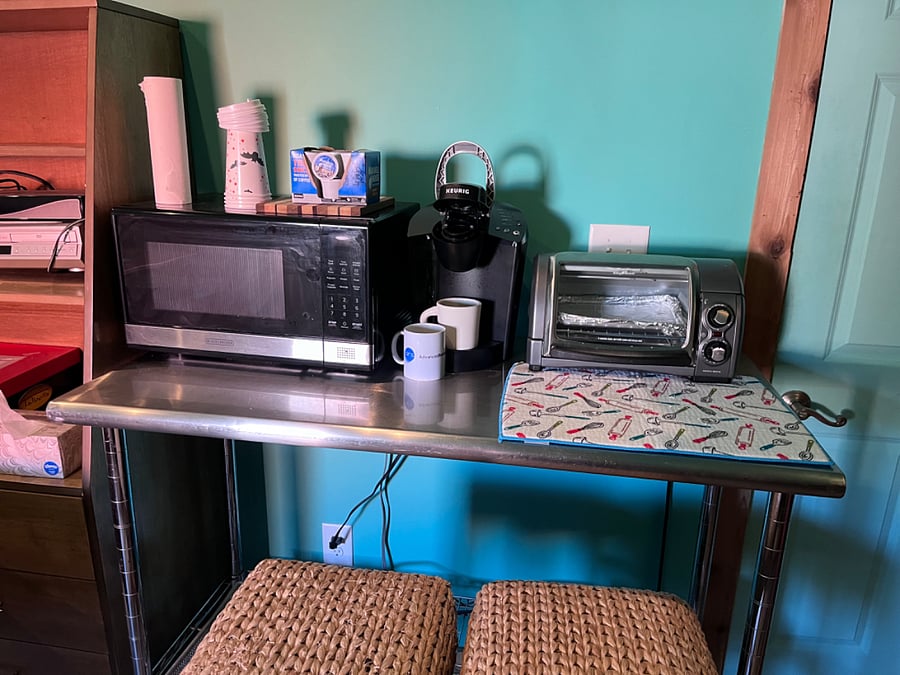 Microwave, keureg coffee maker. Toaster oven, hot plate n dishes.