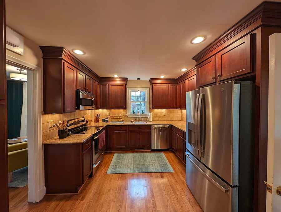 Kitchen Fully stocked and featuring new fridge and electric range.