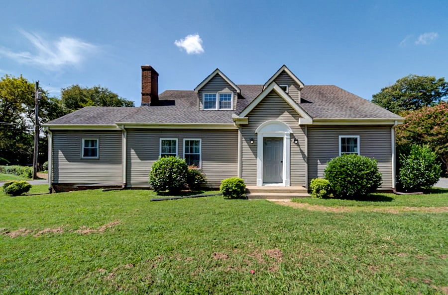 Tri-plex is on a corner lot in a quiet residential neighborhood.