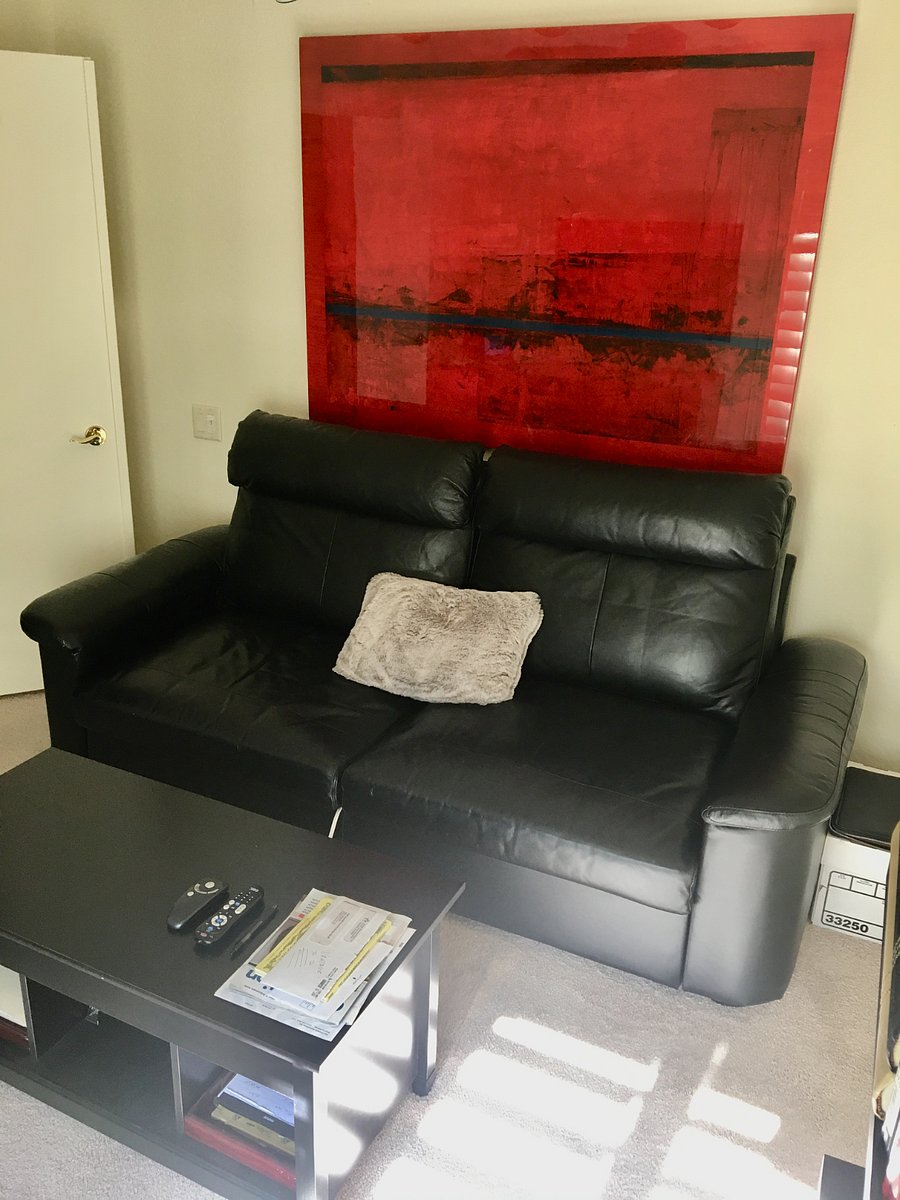 Den with leather sofa and combination desk/coffee table