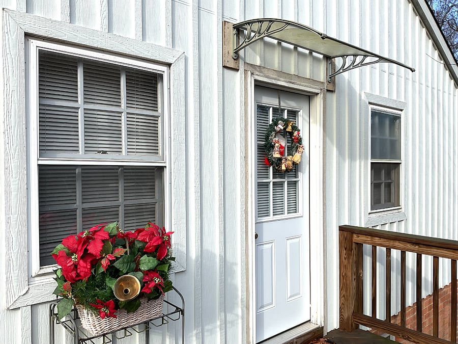This is the private entrance into the formal living room; it has a long private deck right off the parking area.