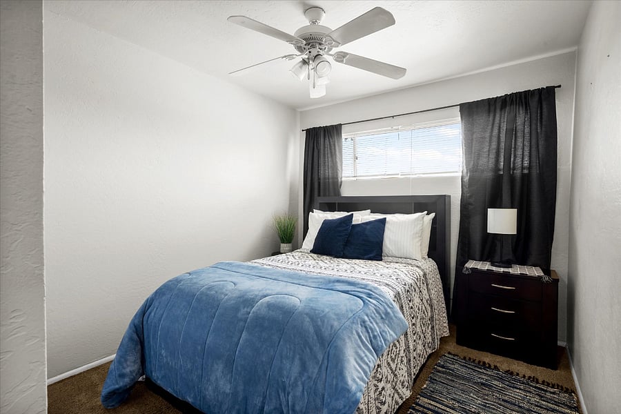 Bedroom 1: Full size bed, night stand and closet.