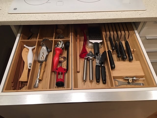 Kitchen utensils, plates, pots and pans are all there