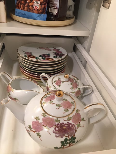 Teapot and desert plates in kitchen pullout pantry